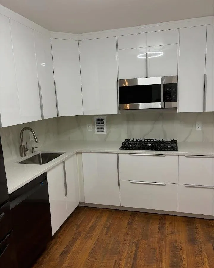 Restored kitchen with white cabinets after water damage in Highland Park